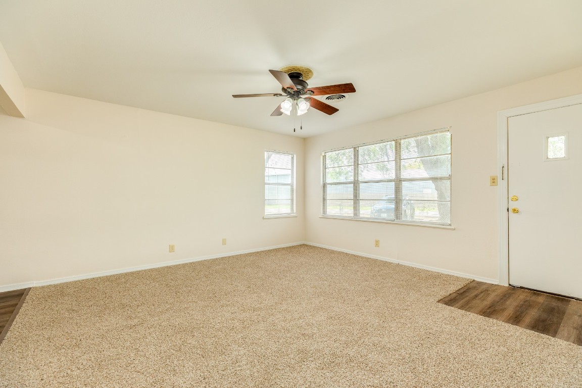 837 Pin Money Street Clute, TX 77531 - Photo 10 of 24 an empty room with windows and fan