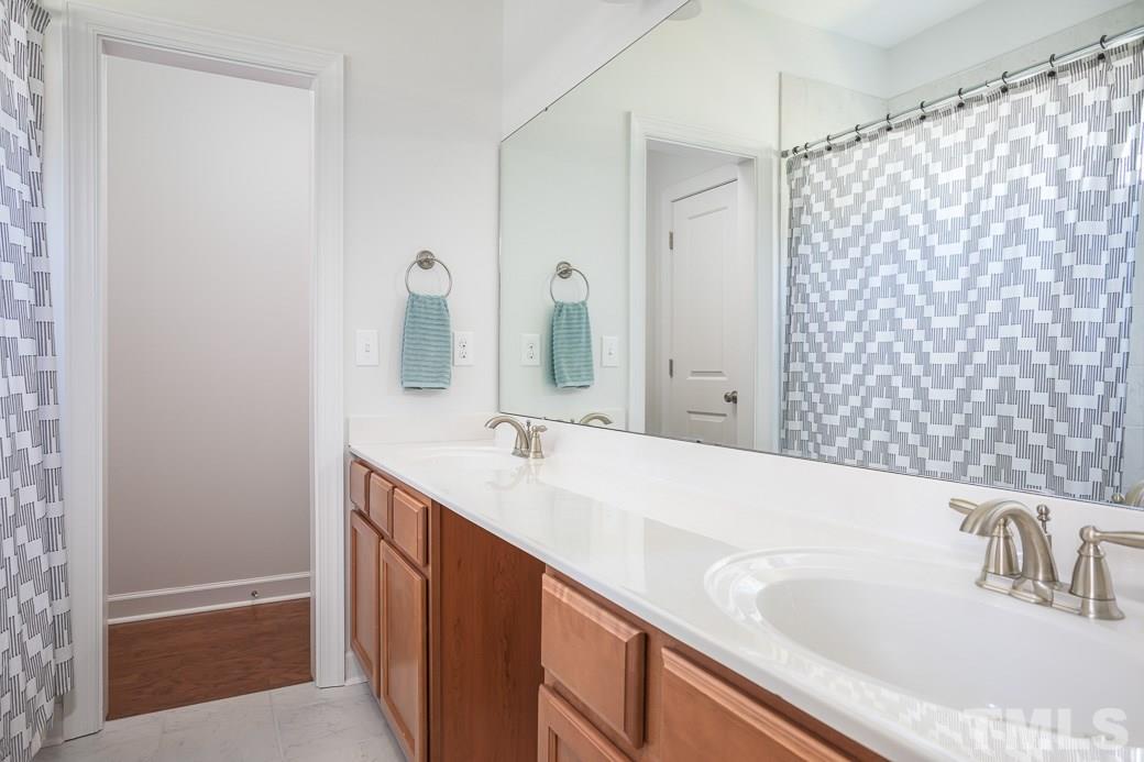 2001 Crystal Lake Road Durham, NC 27705 - Photo 17 of 21 Second bathroom with double vanity sinks