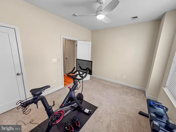 a view of a room with gym equipment