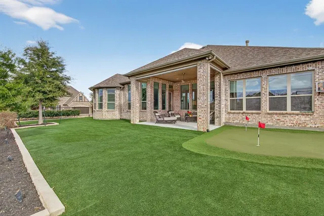 a front view of a house with a yard and porch