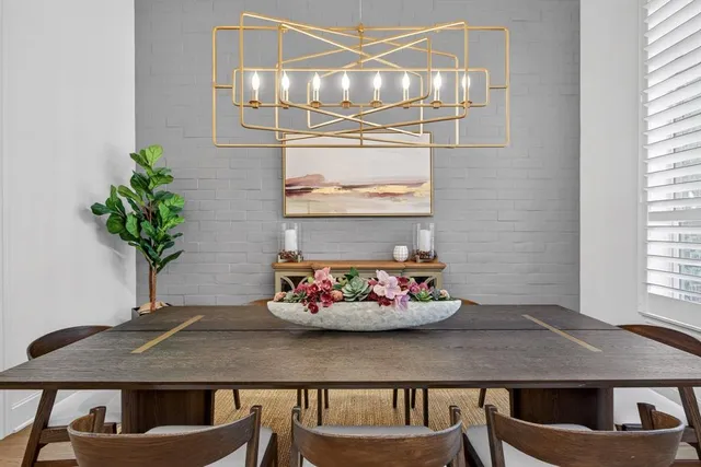 a table with a vase and flowers on it