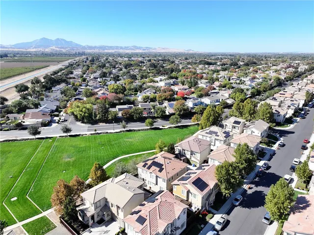 an aerial view of a house with a garden