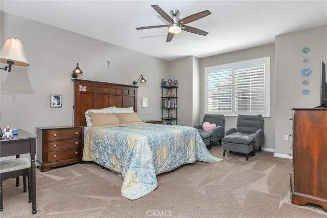 a bedroom with bed and a window