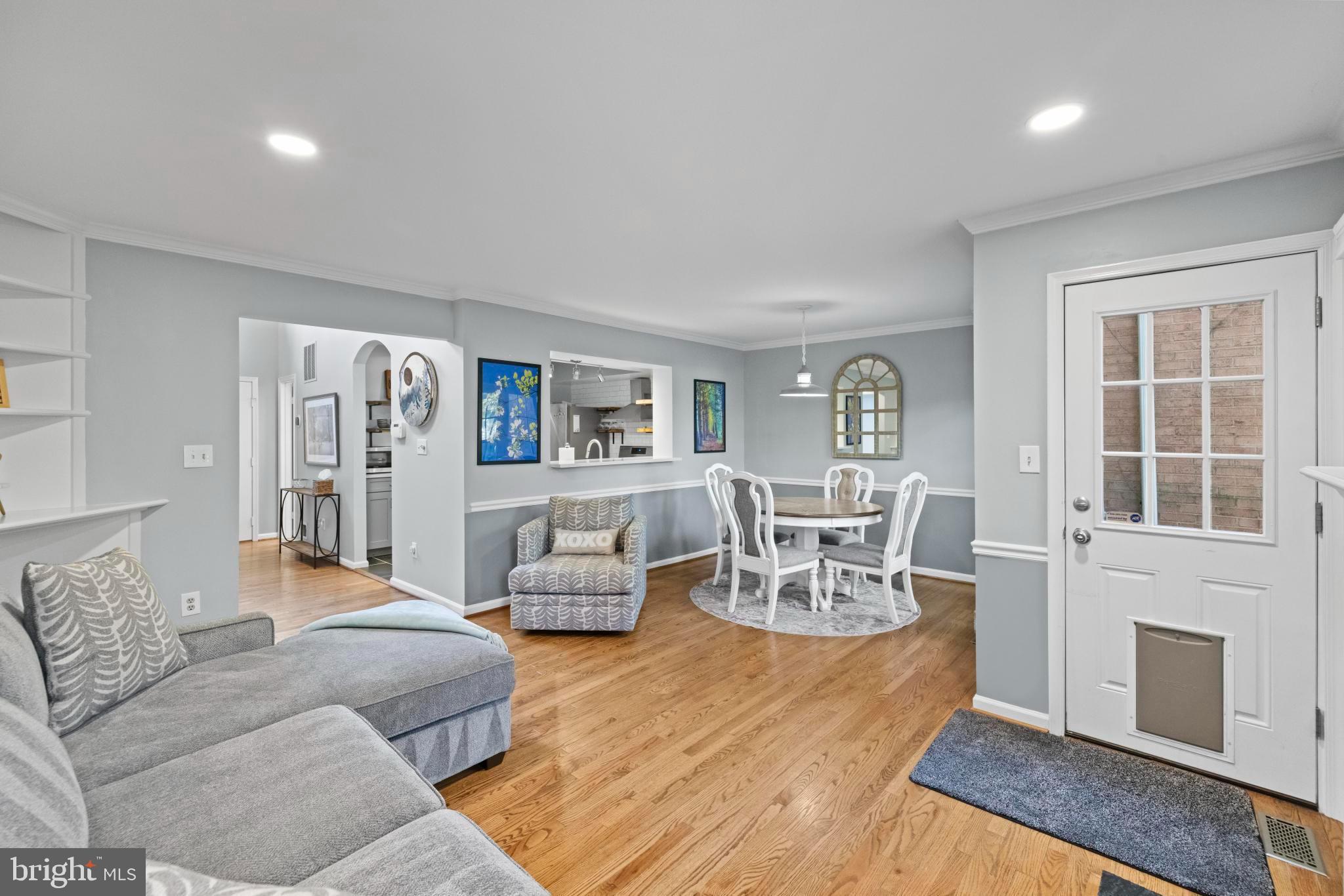 1792 Duffield Lane Alexandria, VA 22307 - Photo 16 of 50 a living room with furniture and a dining table with kitchen view