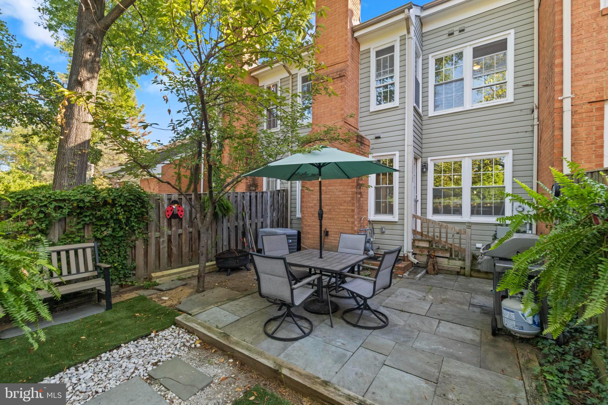 1792 Duffield Lane Alexandria, VA 22307 - Photo 18 of 50 a view of a dinning table and chairs in backyard of the house