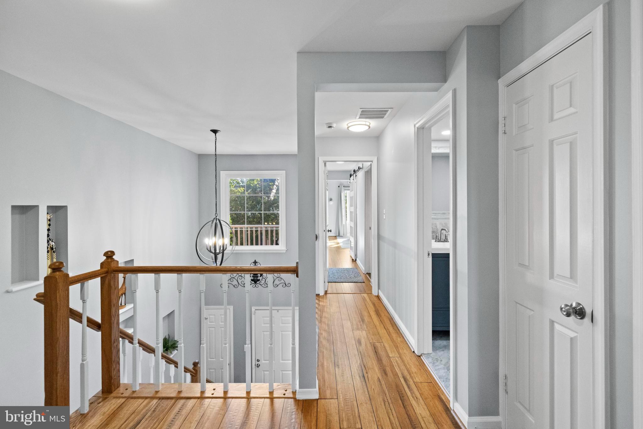 1792 Duffield Lane Alexandria, VA 22307 - Photo 21 of 50 a view of a hallway with wooden floor and stairs