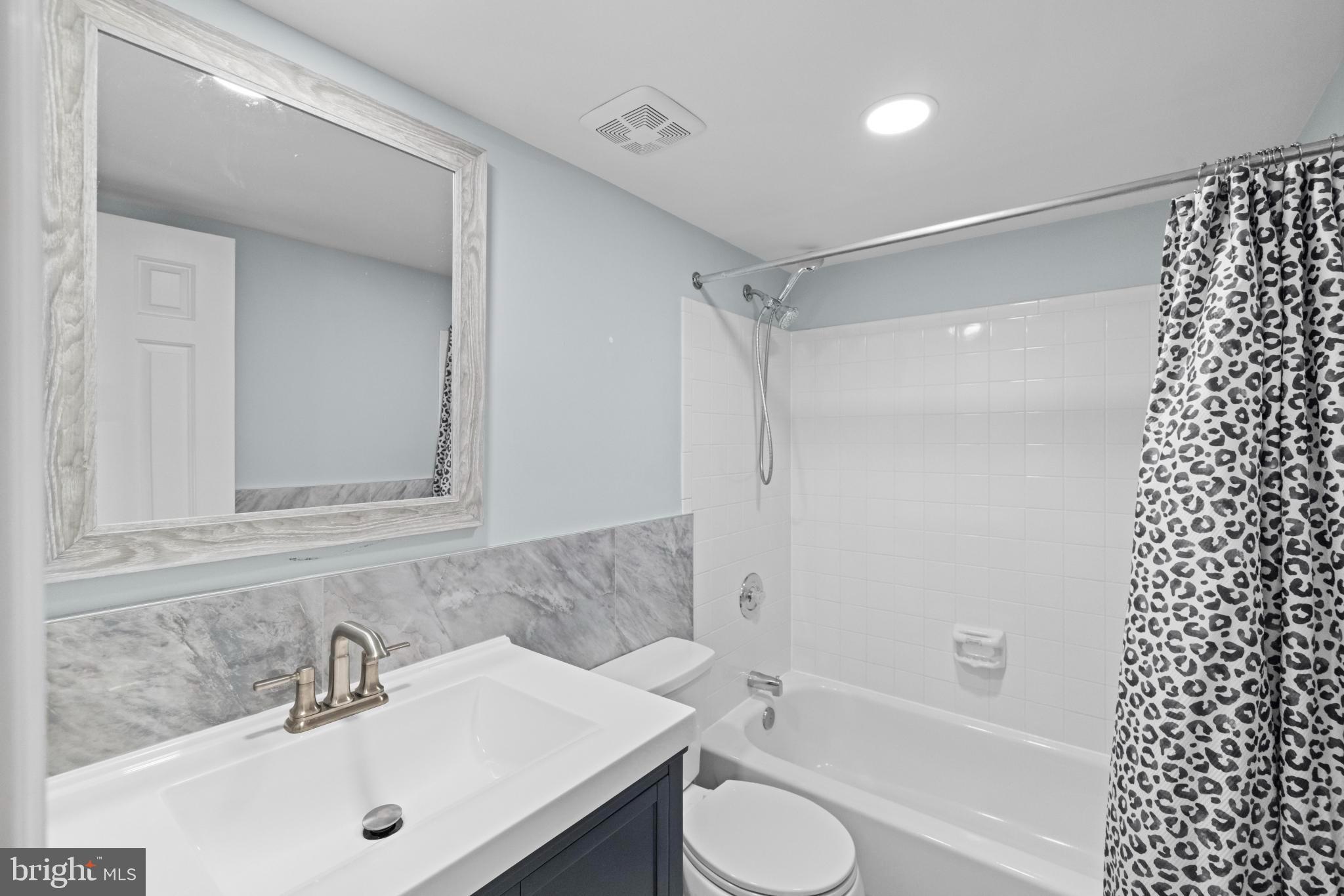 1792 Duffield Lane Alexandria, VA 22307 - Photo 27 of 50 a bathroom with a sink a toilet and shower