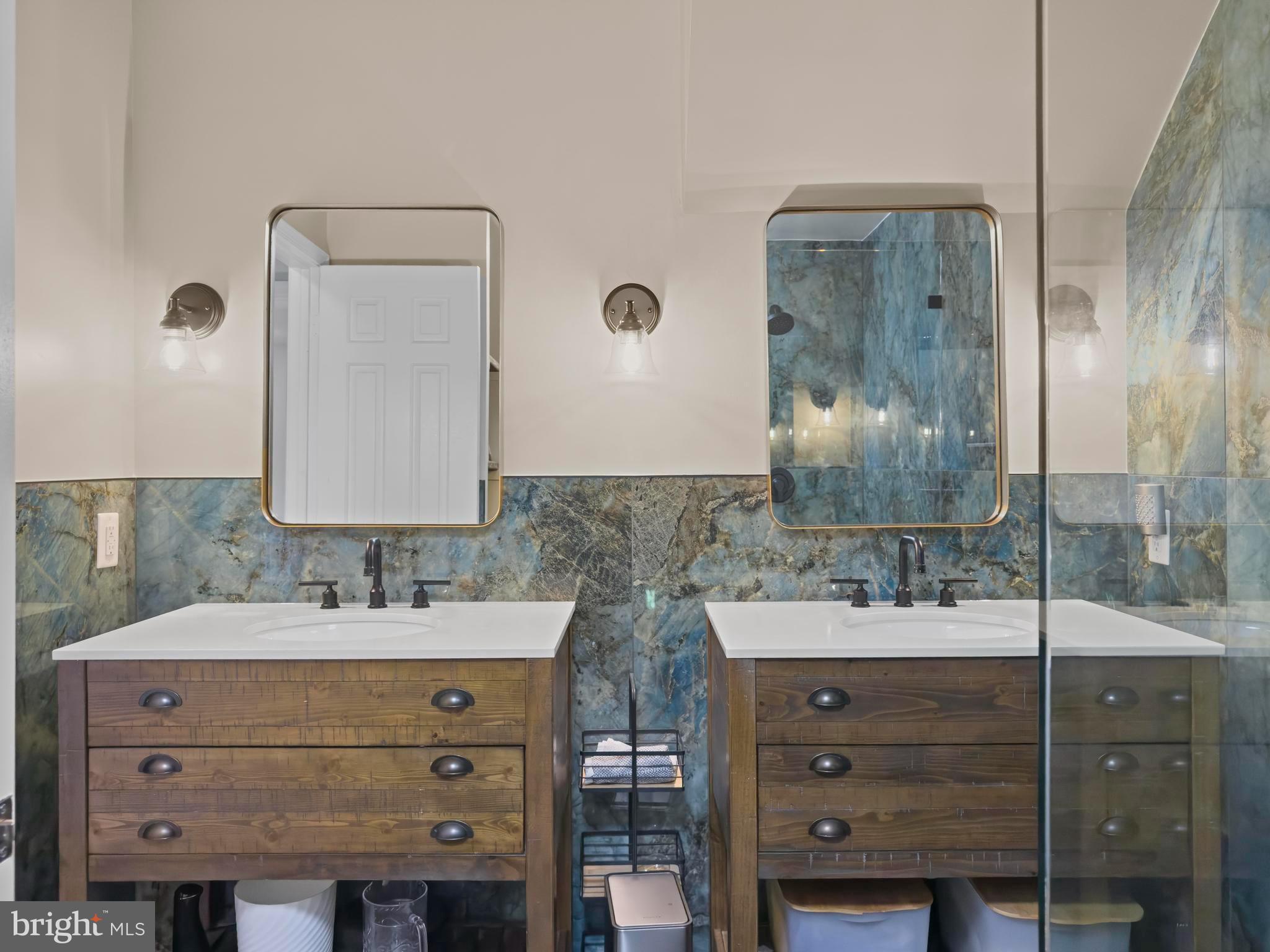 1792 Duffield Lane Alexandria, VA 22307 - Photo 31 of 50 a bathroom with a double vanity sink mirror and shower