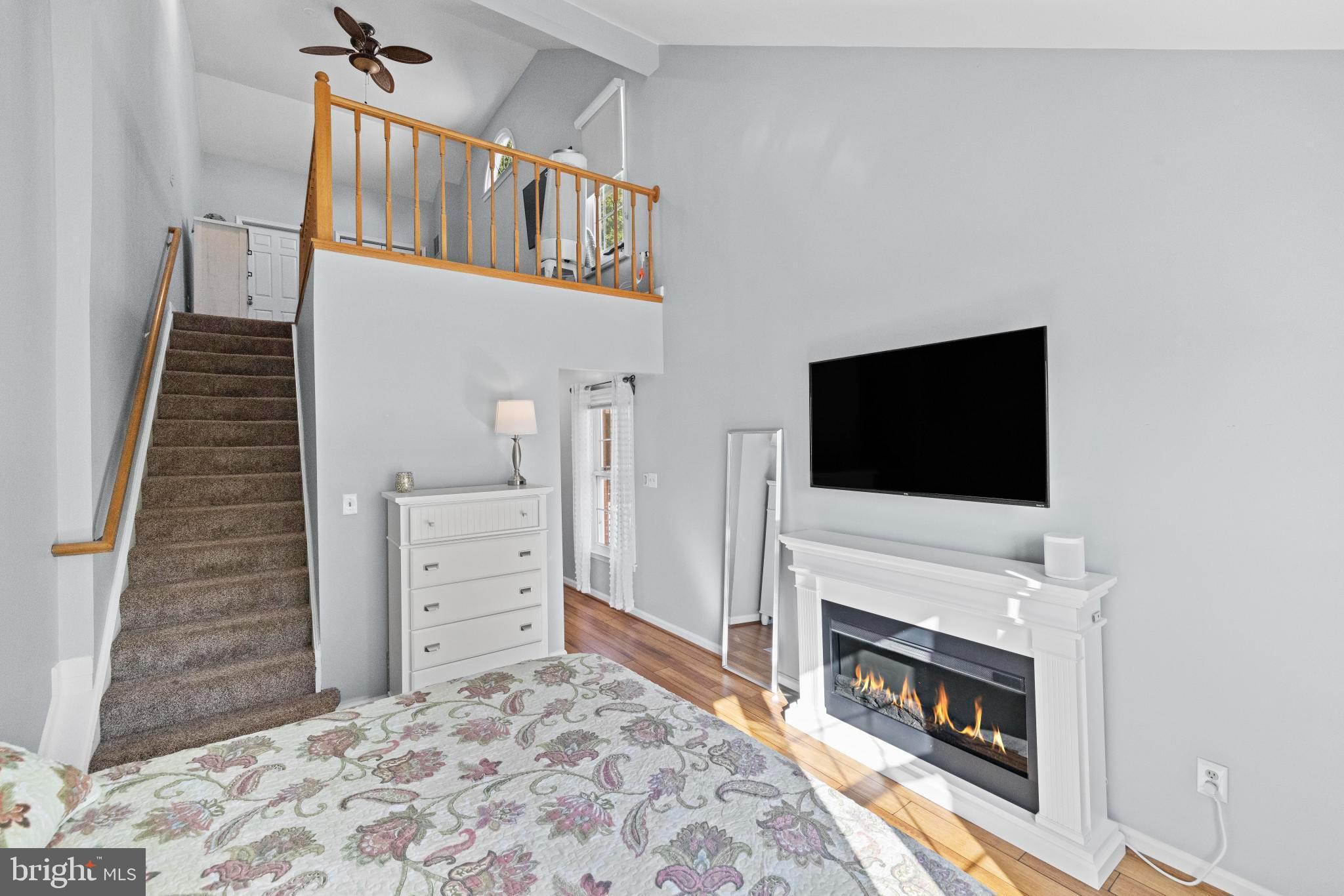 1792 Duffield Lane Alexandria, VA 22307 - Photo 35 of 50 a living room with furniture a flat screen tv and a fireplace