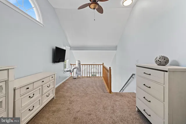 a bedroom with furniture and flat tv screen