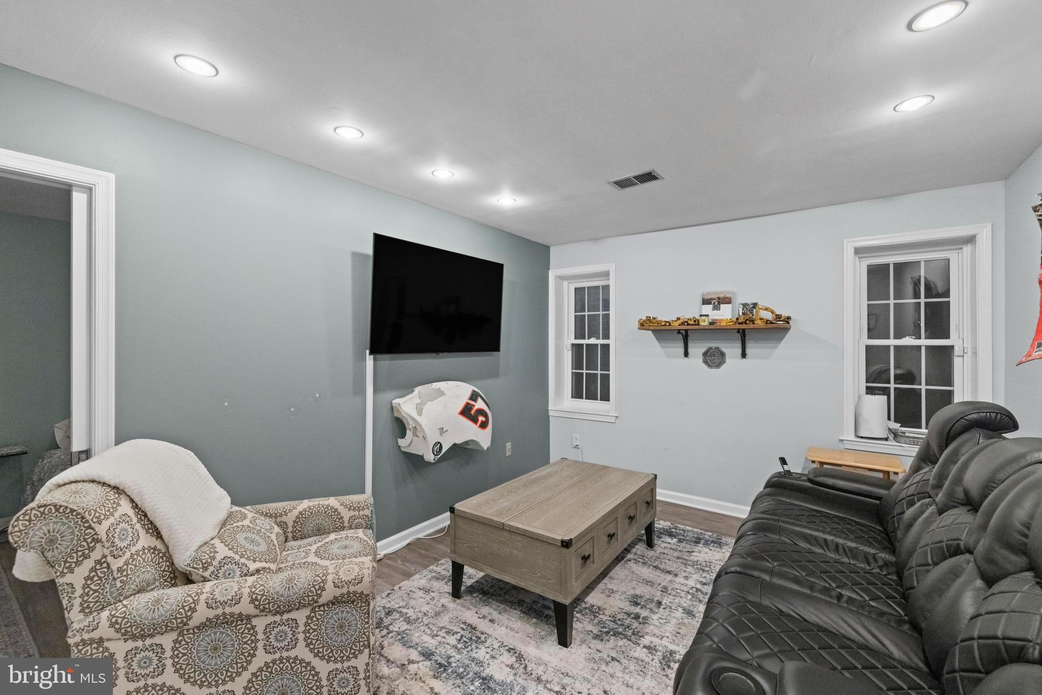 1792 Duffield Lane Alexandria, VA 22307 - Photo 42 of 50 a living room with furniture and a flat screen tv