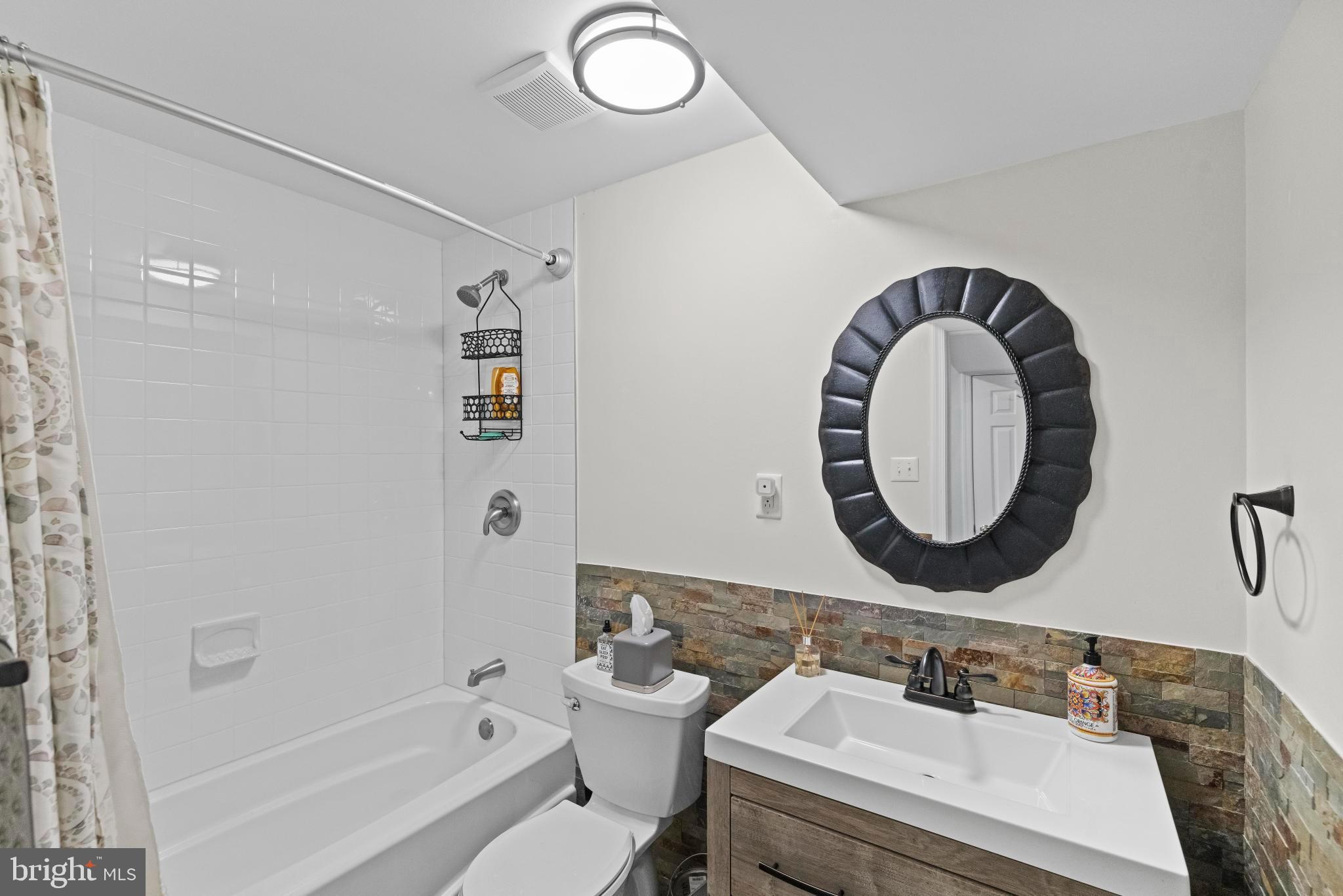 1792 Duffield Lane Alexandria, VA 22307 - Photo 48 of 50 a bathroom with a sink and a mirror