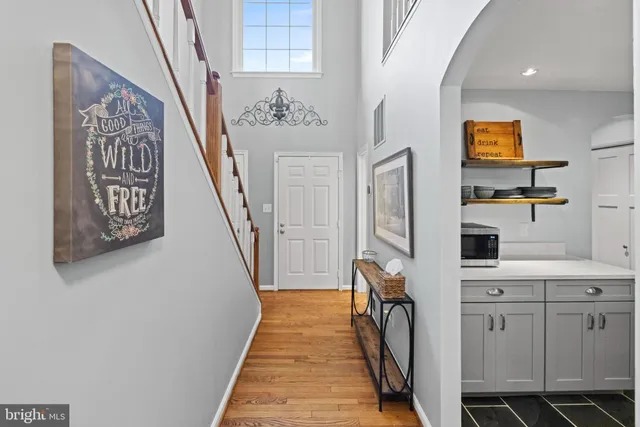 a view of a hallway with washer and dryer