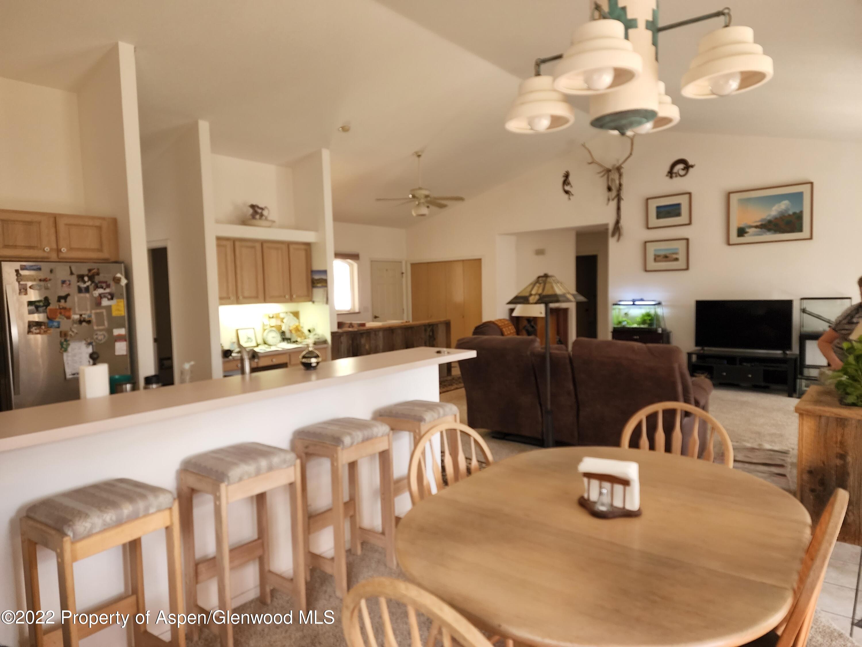 751 Latigo Loop Carbondale, CO 81623 - Photo 14 of 44 a large kitchen with a table and chairs
