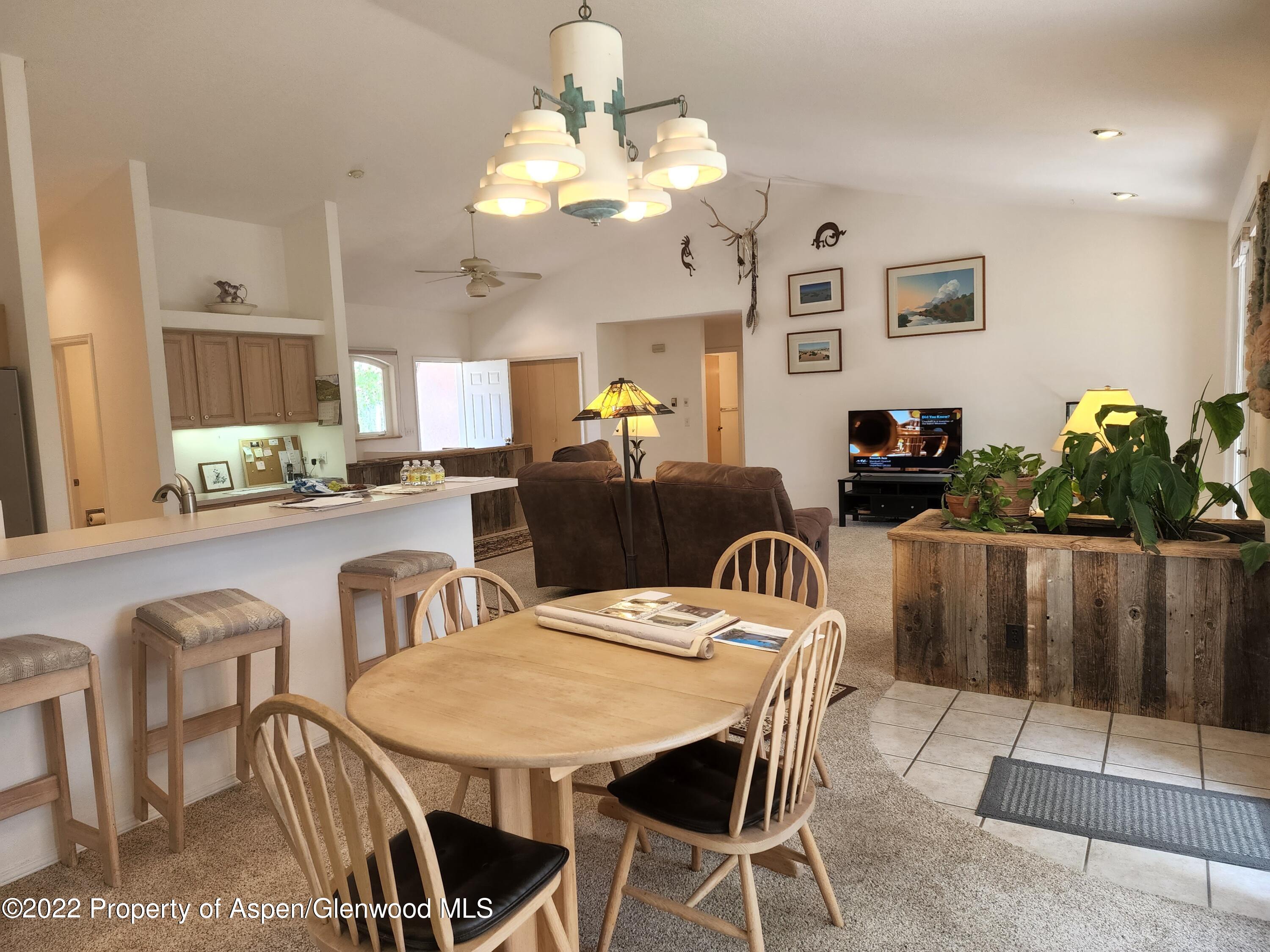 751 Latigo Loop Carbondale, CO 81623 - Photo 16 of 44 a view of a dining room with furniture and wooden floor