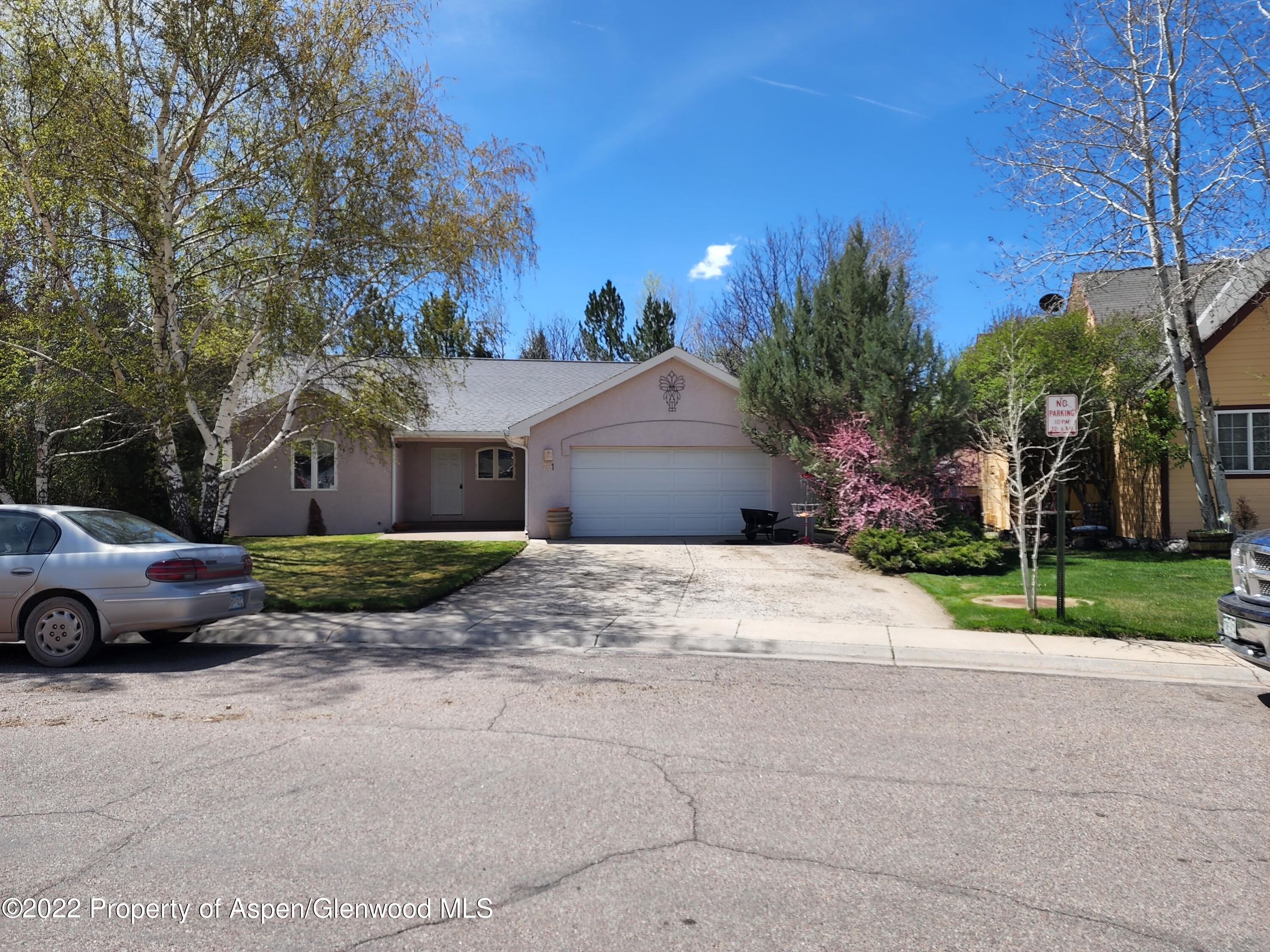 751 Latigo Loop Carbondale, CO 81623 - Photo 2 of 44 a front view of a house with a yard and garage