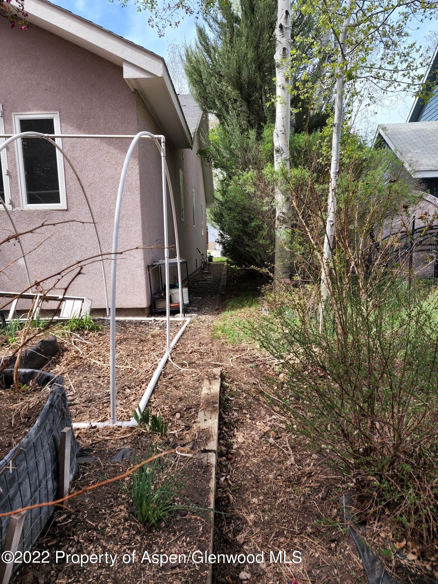 751 Latigo Loop Carbondale, CO 81623 - Photo 33 of 44 a backyard of a house with lots of green space