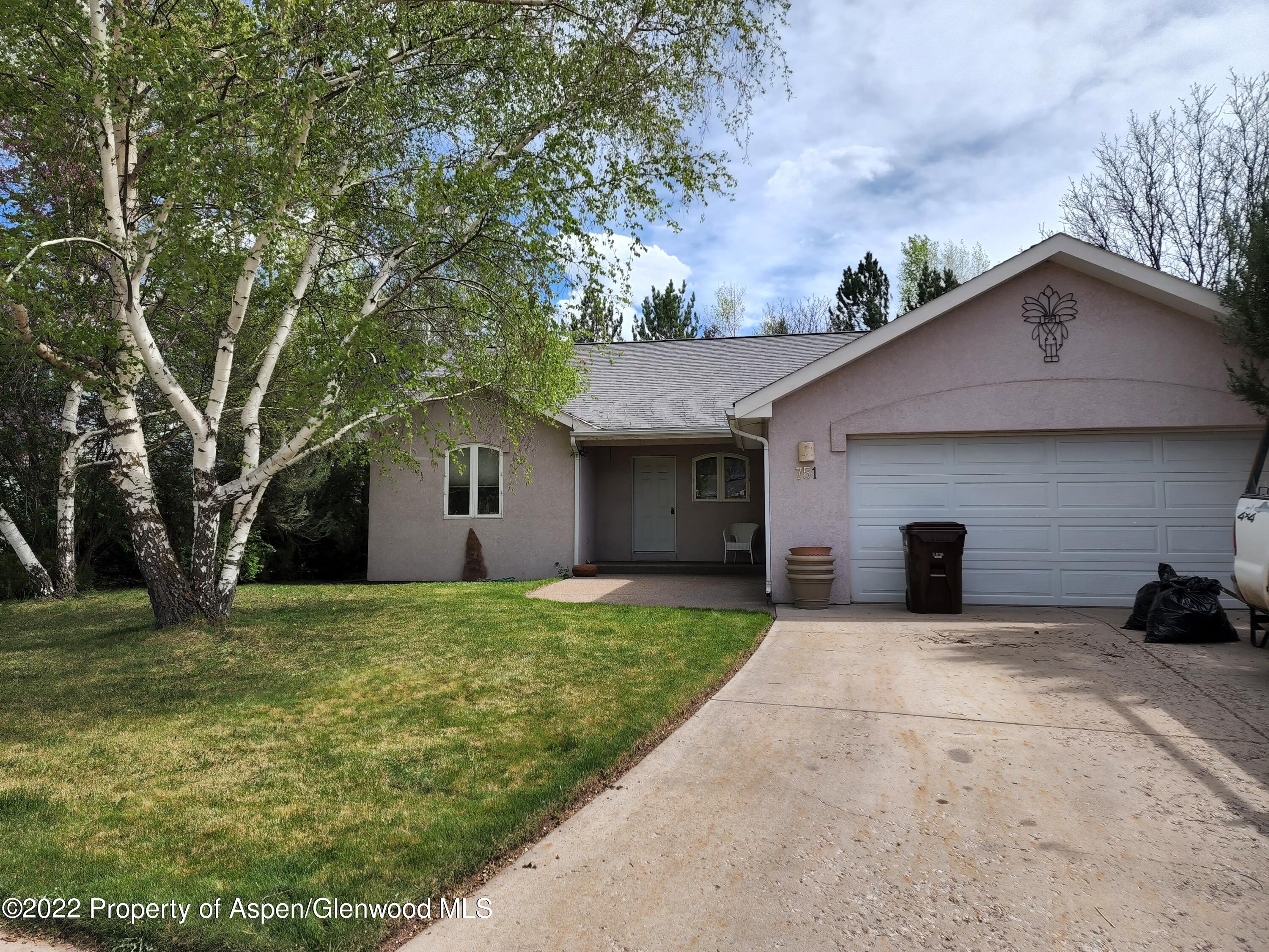 751 Latigo Loop Carbondale, CO 81623 - Photo 35 of 44 a house that has a tree in front of it