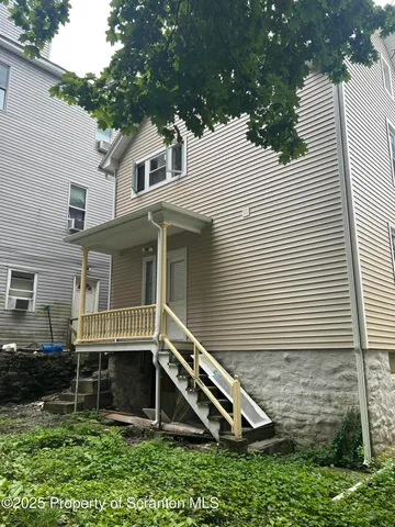 a house view with a backyard space