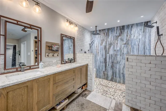a bathroom with a double vanity sink and a mirror