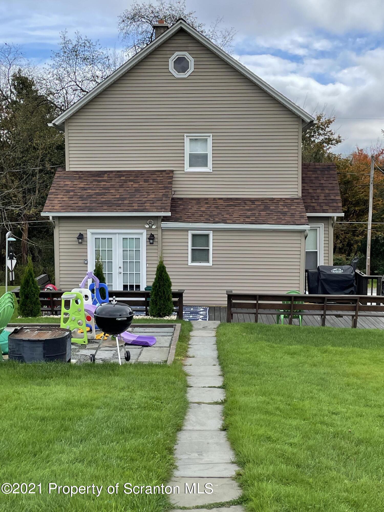425 Clinton Street Vandling, PA 18421 - Photo 29 of 32 a front view of house with yard and outdoor seating