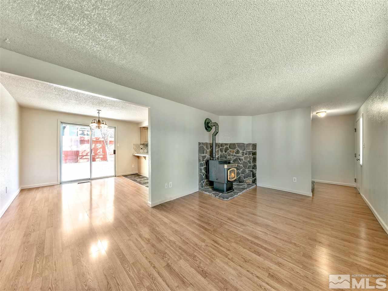 7460 Berryhill Drive Reno, NV 89511 - Photo 11 of 23 a view of an empty room and wooden floor