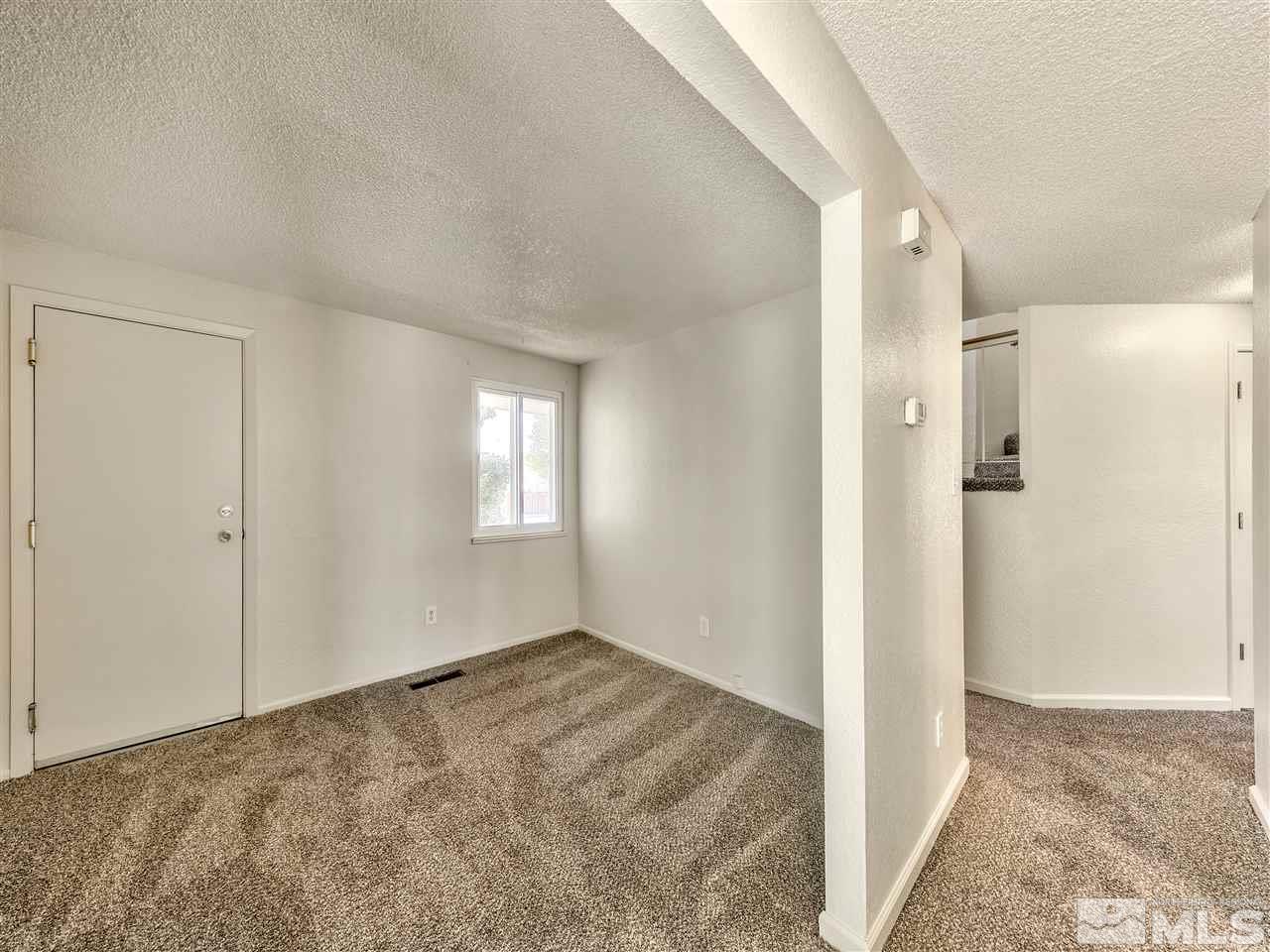 7460 Berryhill Drive Reno, NV 89511 - Photo 15 of 23 a view of livingroom with an empty space and window