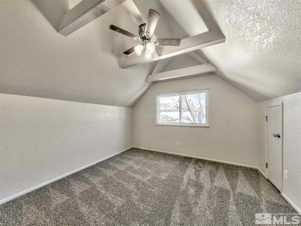 7460 Berryhill Drive Reno, NV 89511 - Photo 19 of 23 an empty room with a window and a ceiling fan