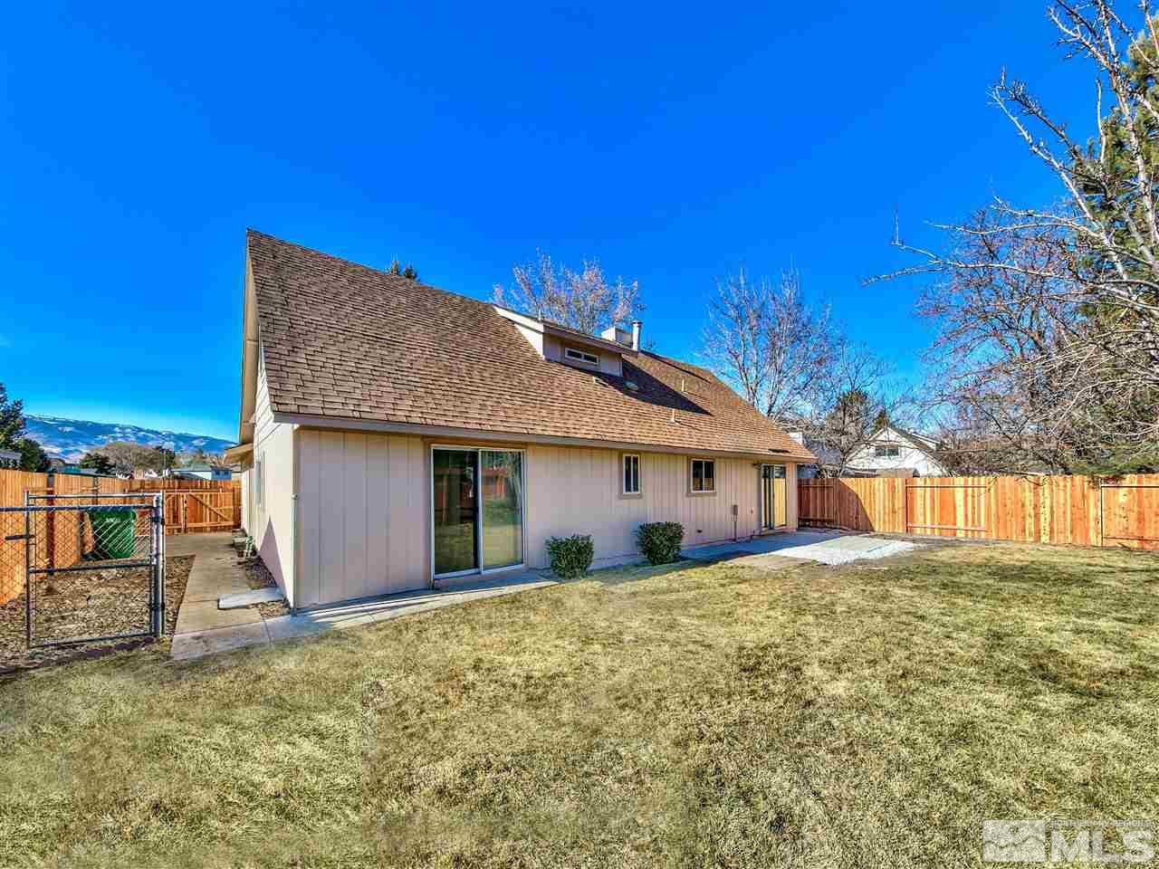 7460 Berryhill Drive Reno, NV 89511 - Photo 4 of 23 a view of a house with a yard