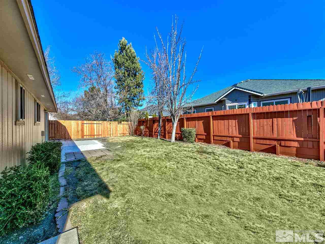 7460 Berryhill Drive Reno, NV 89511 - Photo 5 of 23 a view of a house with a yard