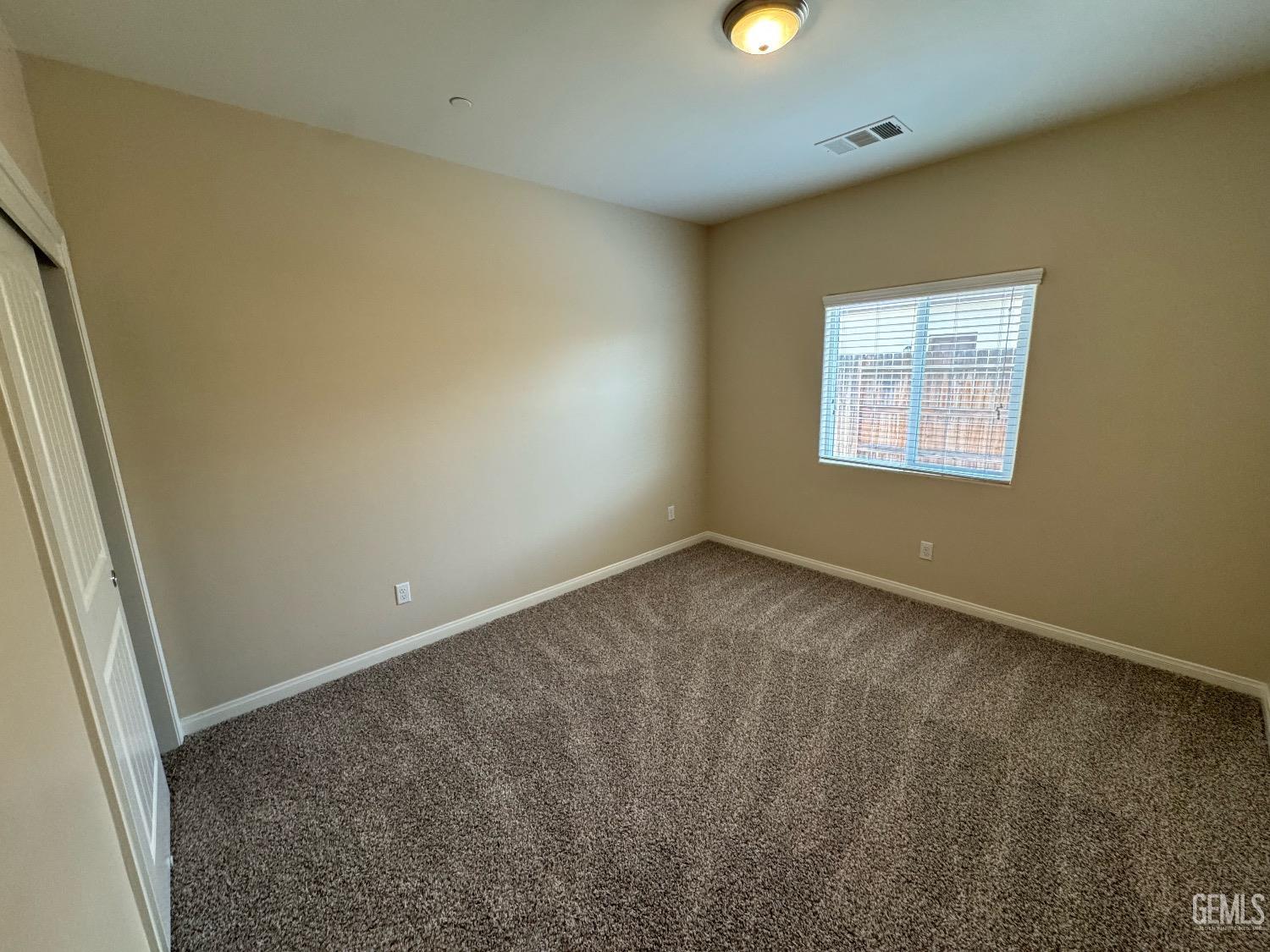 Undisclosed Address Bakersfield, CA 93313 - Photo 11 of 16 an empty room with a window