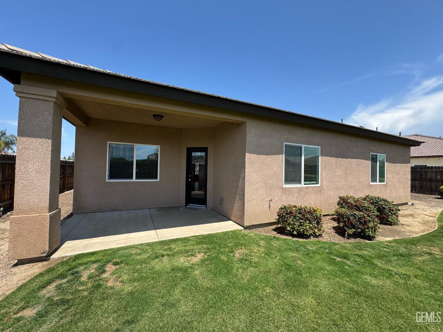 Undisclosed Address Bakersfield, CA 93313 - Photo 15 of 16 a backyard of a house with table and chairs