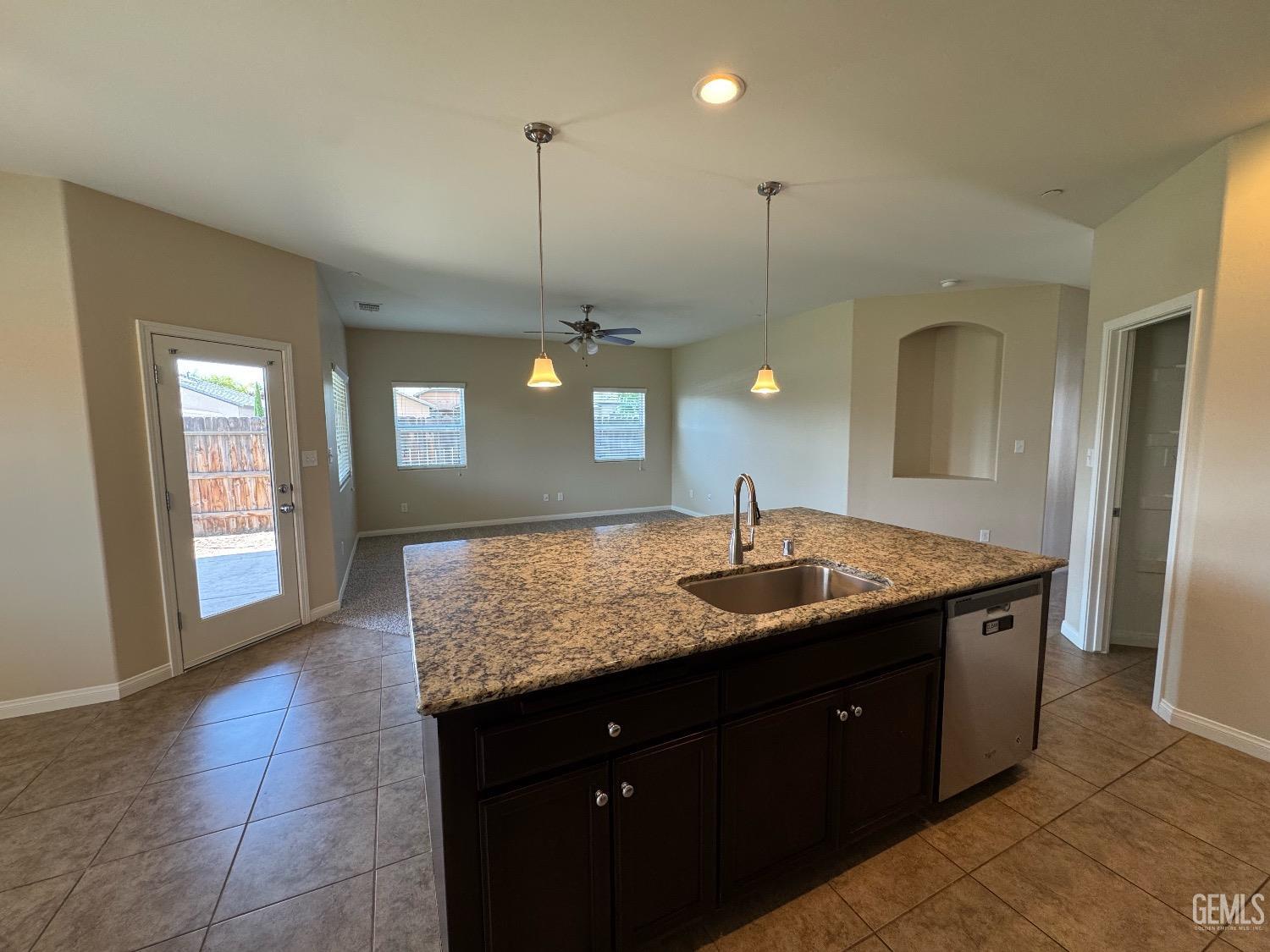 Undisclosed Address Bakersfield, CA 93313 - Photo 4 of 16 a bathroom with a granite countertop sink a toilet and a mirror
