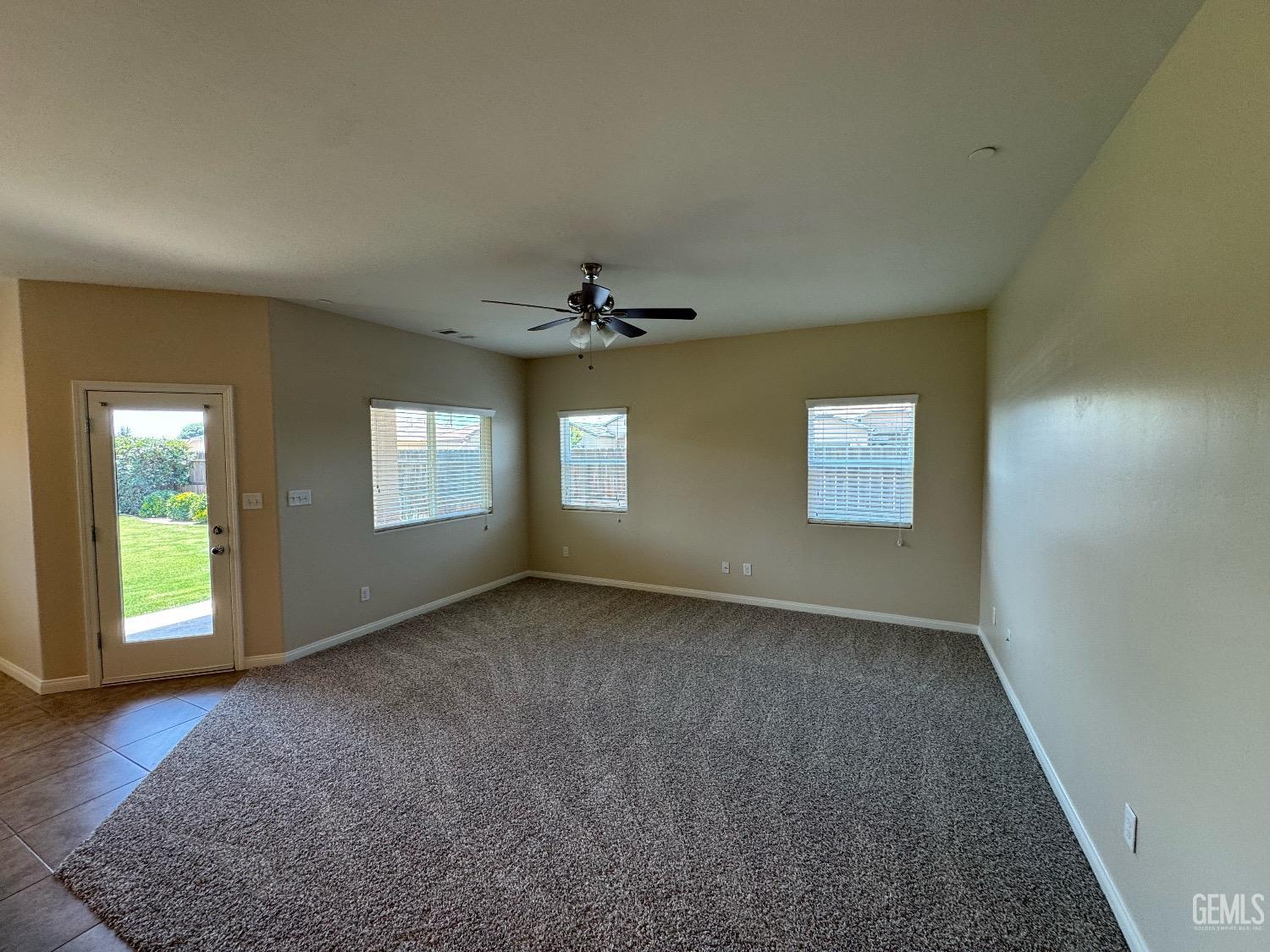 Undisclosed Address Bakersfield, CA 93313 - Photo 6 of 16 an empty room with windows and closet