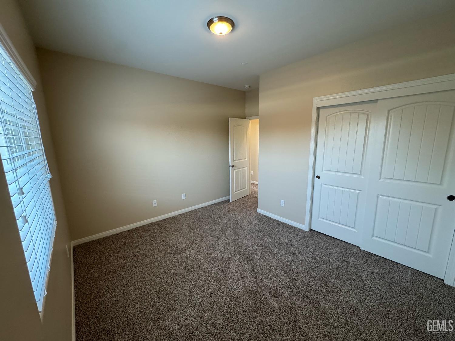 Undisclosed Address Bakersfield, CA 93313 - Photo 8 of 16 a view of an empty room and a window