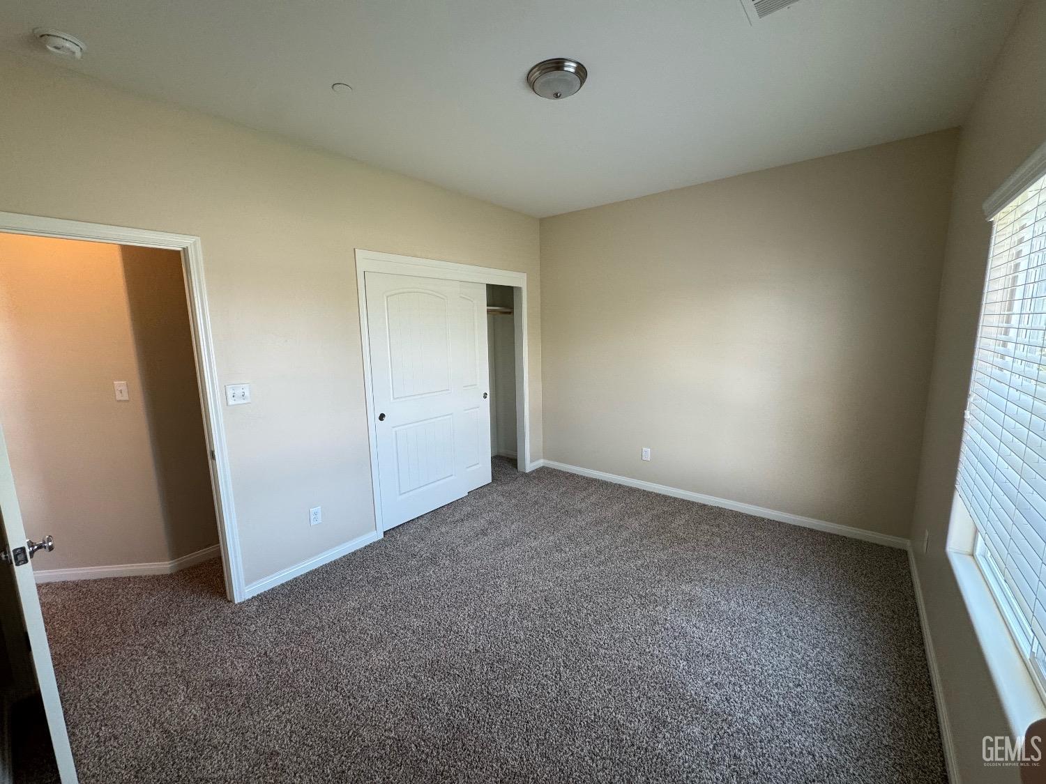 Undisclosed Address Bakersfield, CA 93313 - Photo 10 of 16 an empty room with windows