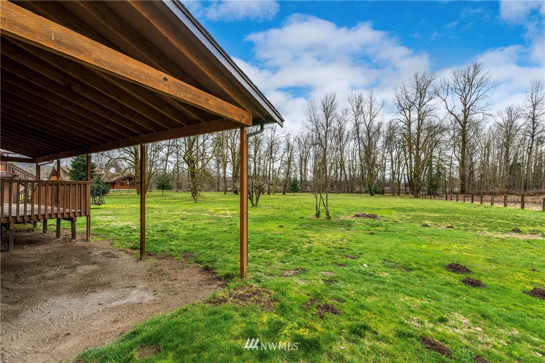 7456 Riverside Drive East Sumner, WA 98390 - Photo 21 of 40 a view of a backyard with grass