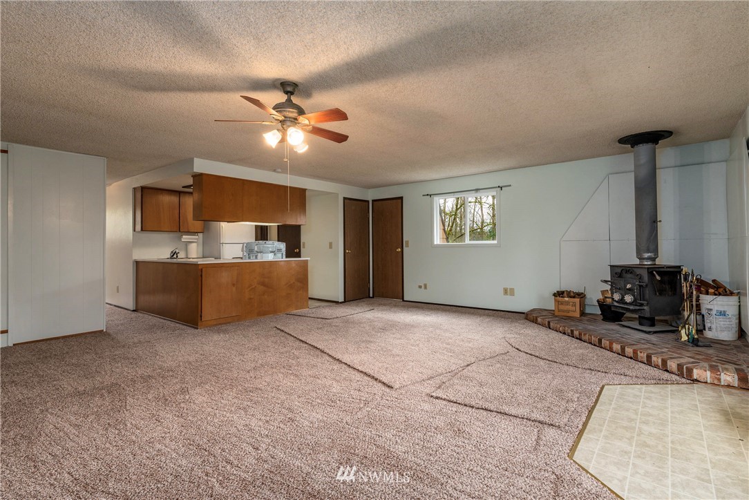 7456 Riverside Drive East Sumner, WA 98390 - Photo 24 of 40 a view of a kitchen with a sink and a window