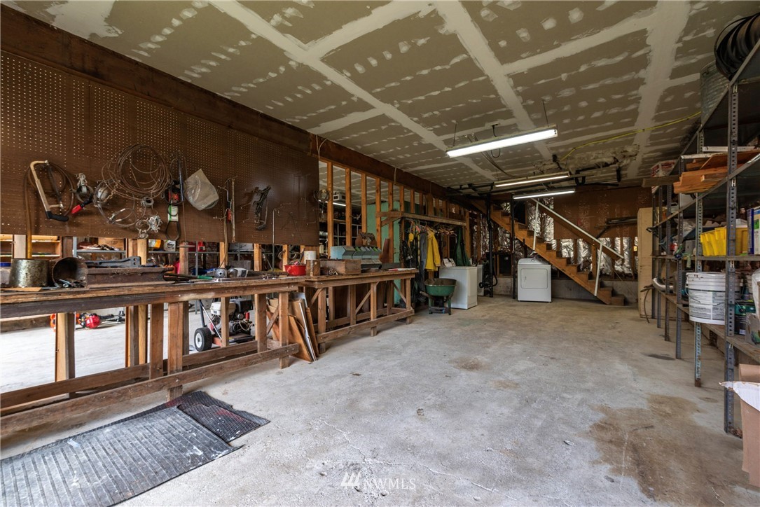 7456 Riverside Drive East Sumner, WA 98390 - Photo 30 of 40 a view of an empty room with wooden floor