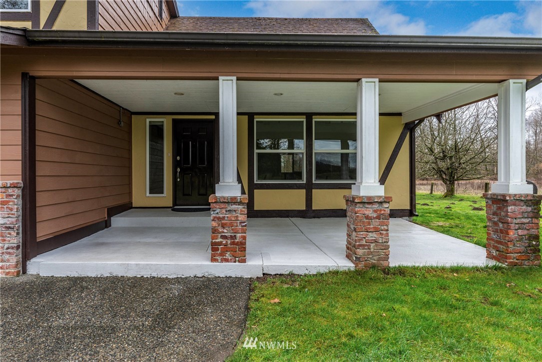 7456 Riverside Drive East Sumner, WA 98390 - Photo 6 of 40 a front view of a house with a porch