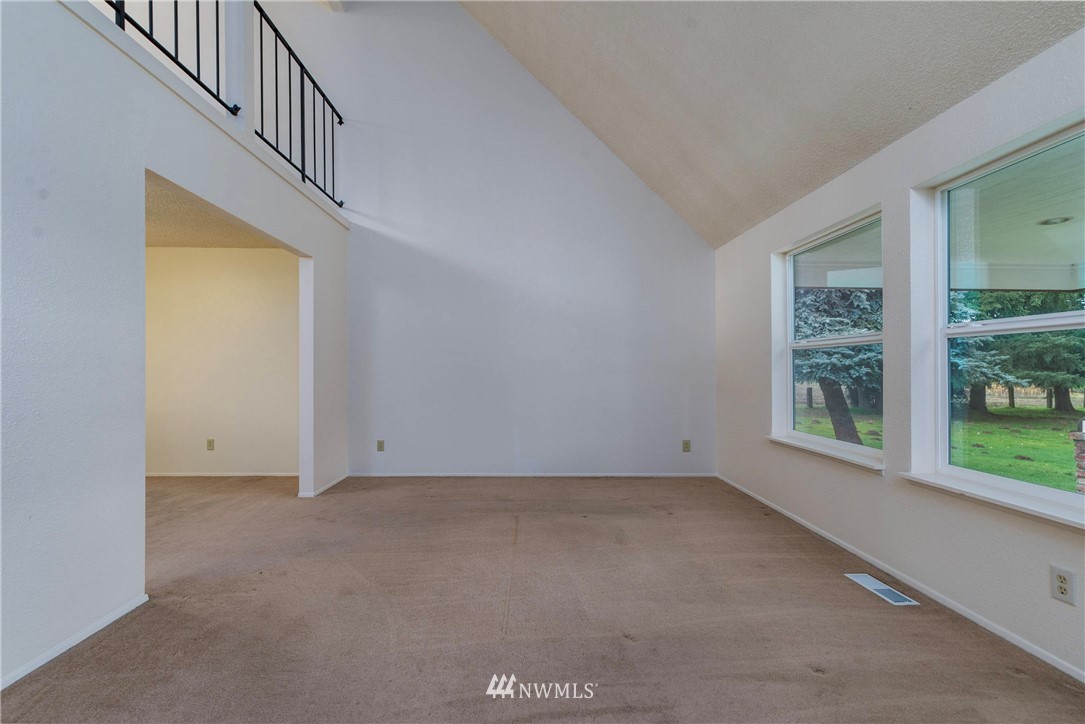 7456 Riverside Drive East Sumner, WA 98390 - Photo 9 of 40 a view of an empty room with a window