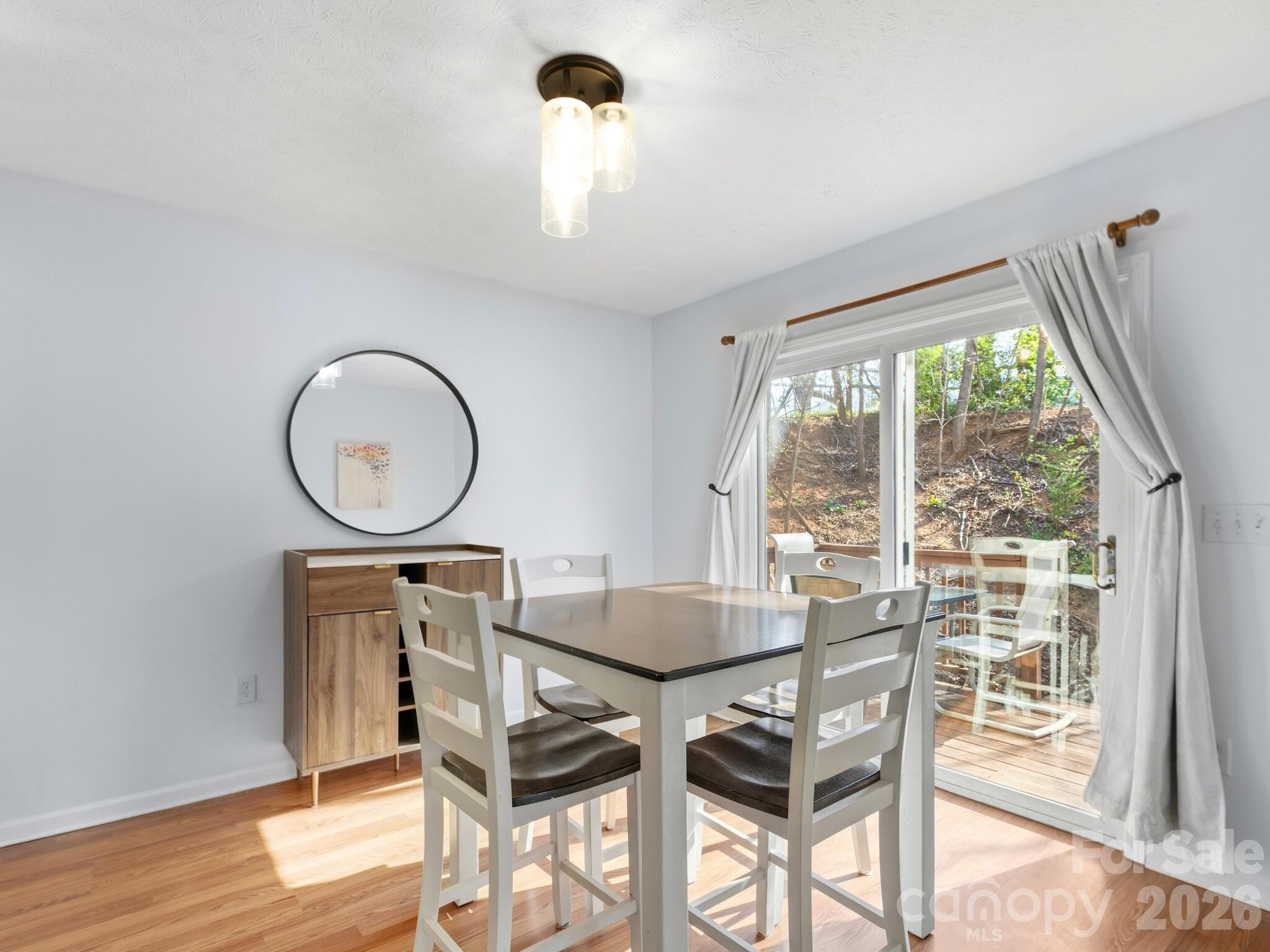 1 Mosers Place Candler, NC 28715 - Photo 14 of 32 a view of a dining room with furniture window and wooden floor