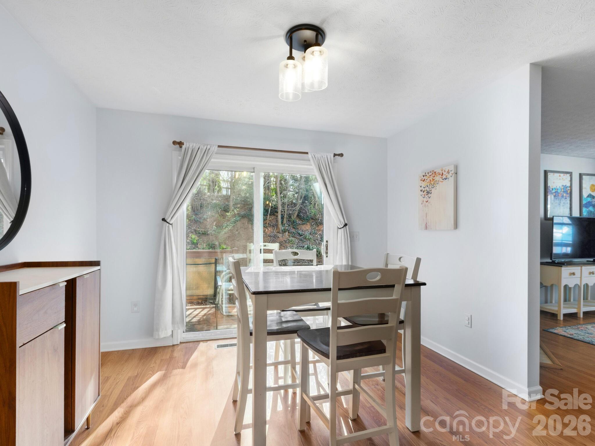 1 Mosers Place Candler, NC 28715 - Photo 15 of 32 a view of a dining room with furniture window and outside view
