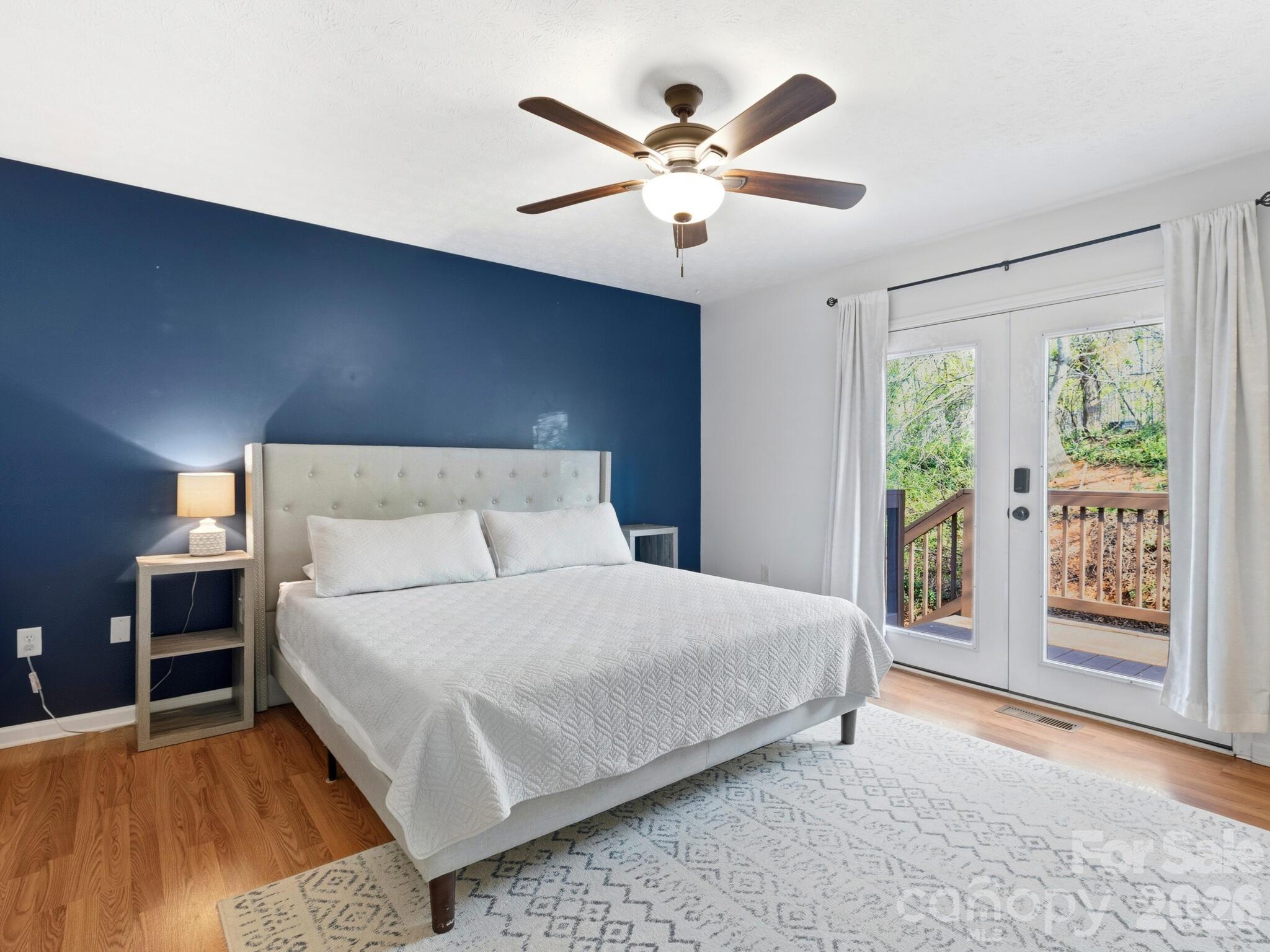 1 Mosers Place Candler, NC 28715 - Photo 17 of 32 a bedroom with a large bed and a large window