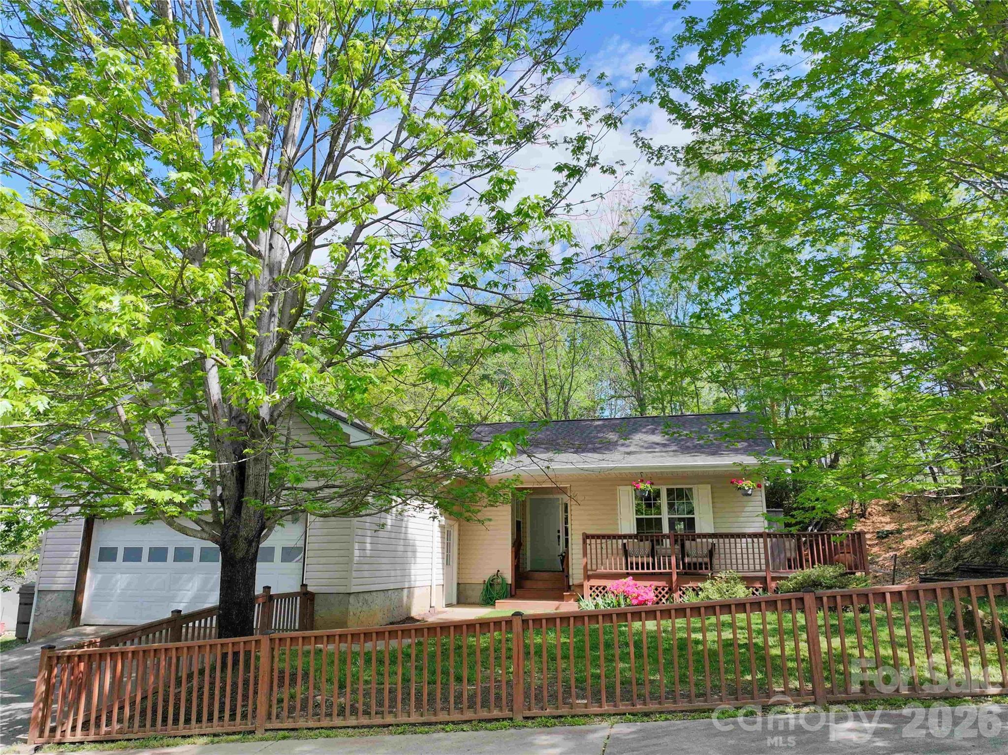 1 Mosers Place Candler, NC 28715 - Photo 28 of 32 a front view of a house with garden