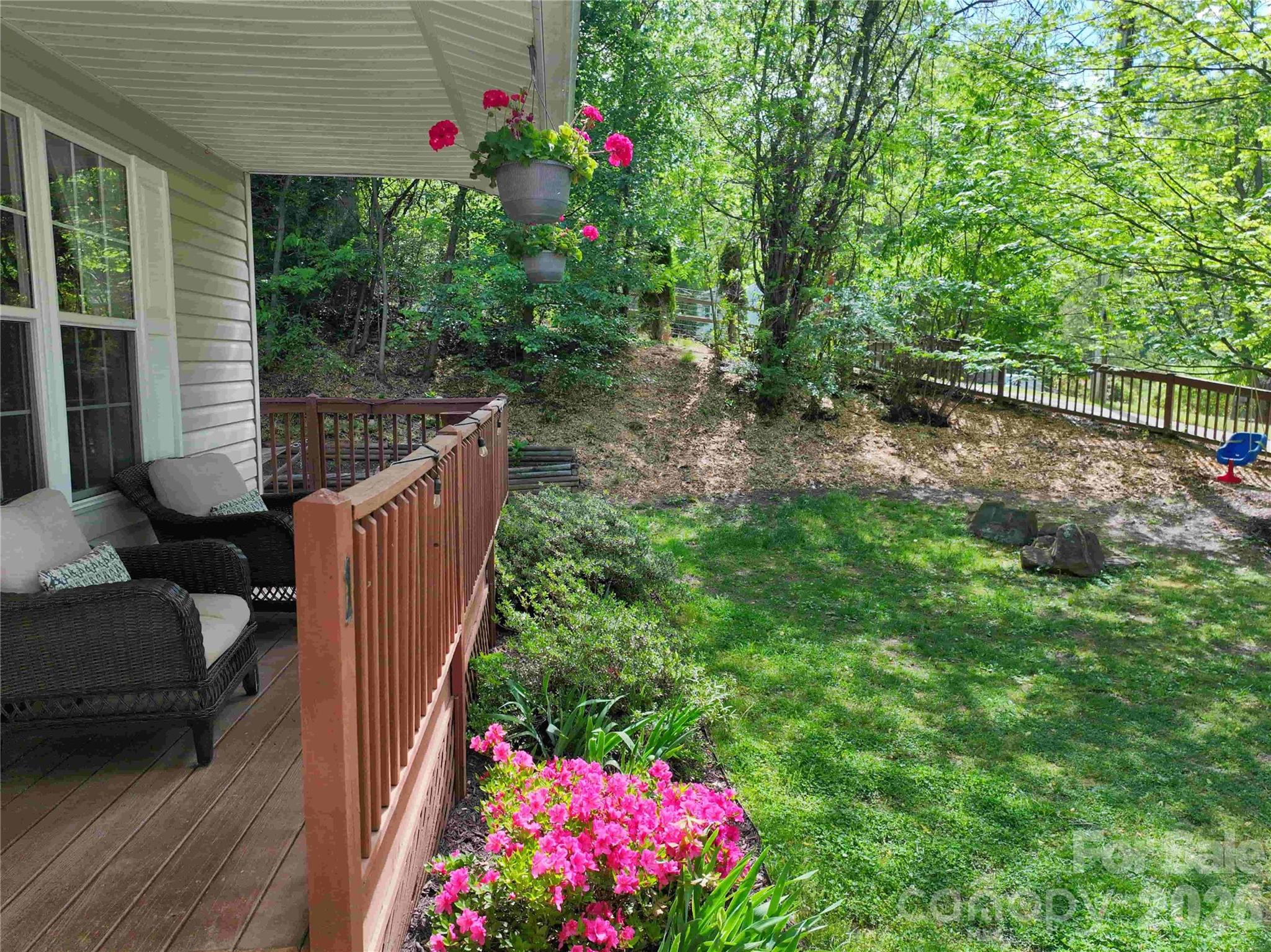 1 Mosers Place Candler, NC 28715 - Photo 4 of 32 a view of a house with a flower garden