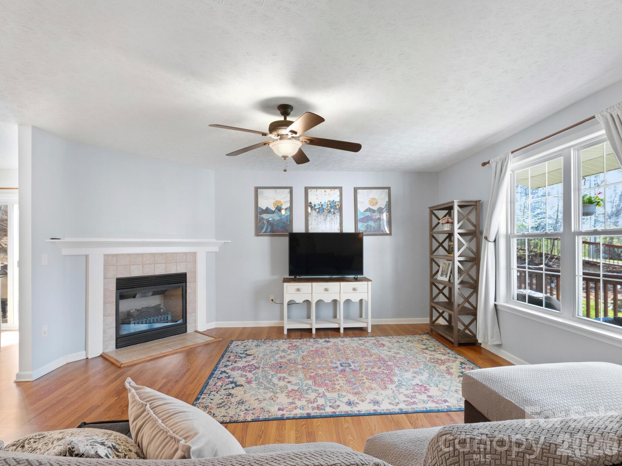 1 Mosers Place Candler, NC 28715 - Photo 6 of 32 a living room with furniture and a fireplace