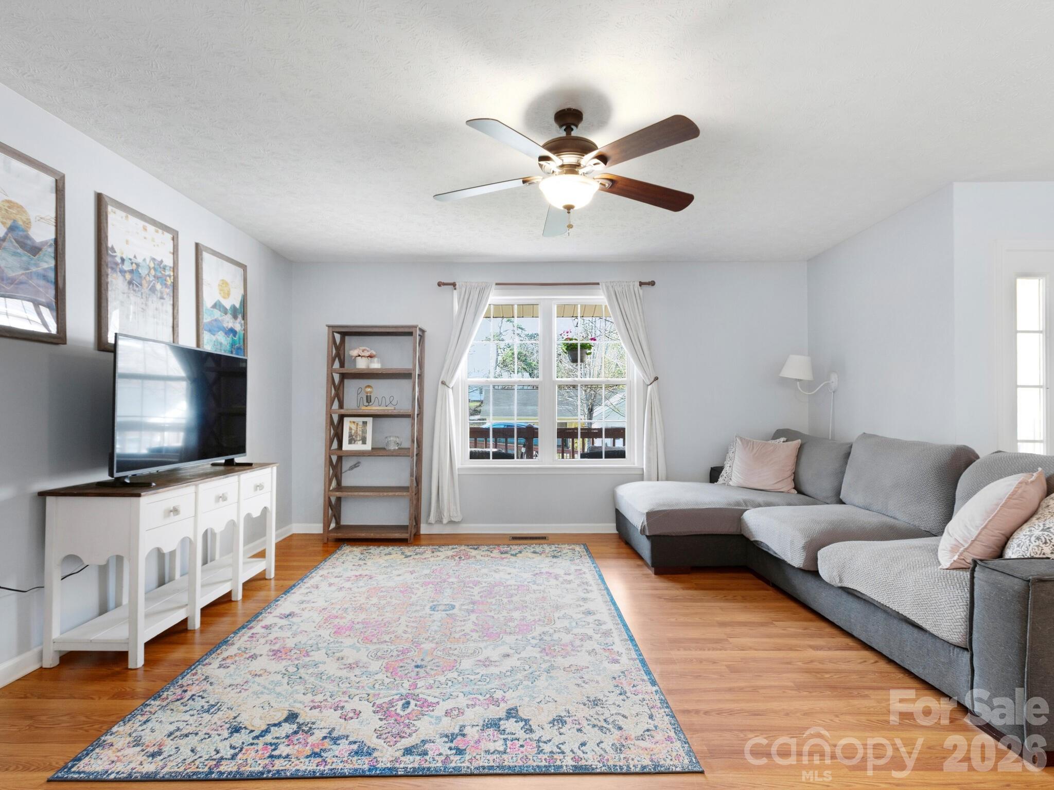1 Mosers Place Candler, NC 28715 - Photo 7 of 32 a living room with furniture and a flat screen tv