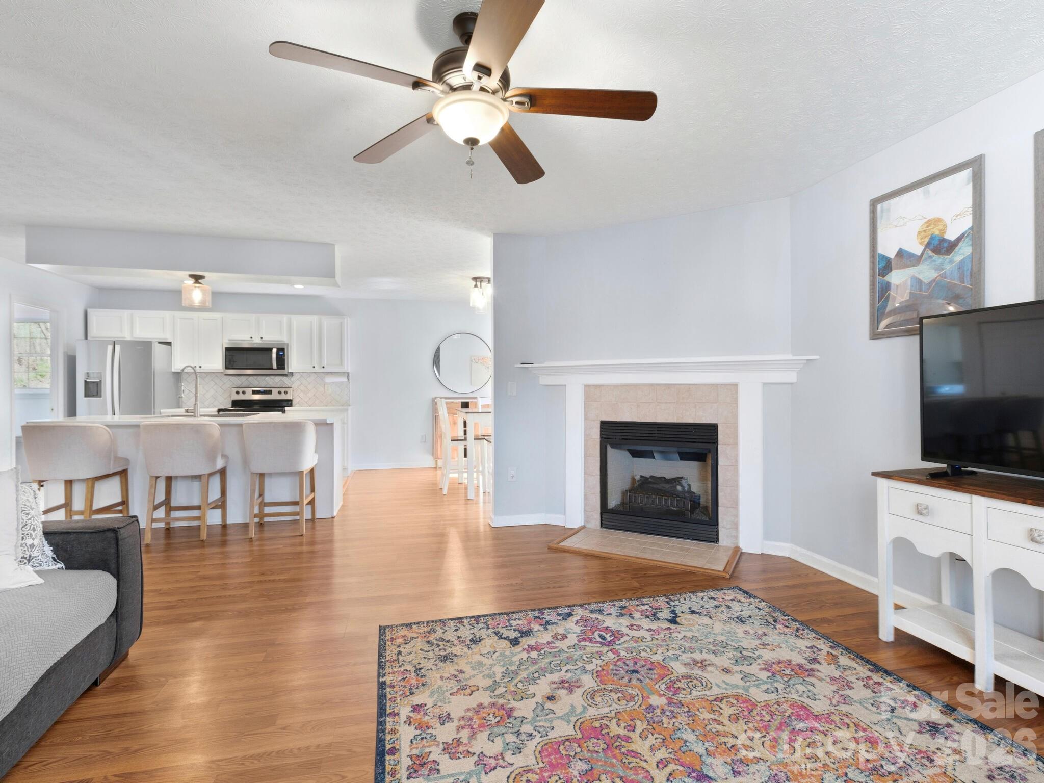 1 Mosers Place Candler, NC 28715 - Photo 8 of 32 a living room with furniture fireplace and flat screen tv