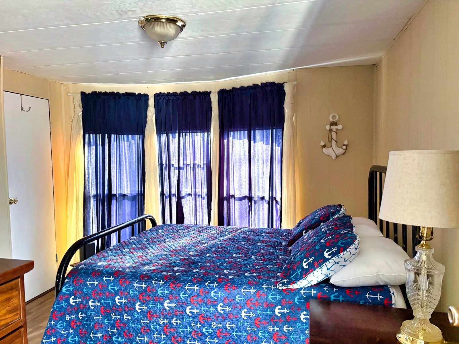 743 Brownfield Road Dover, TN 37058 - Photo 16 of 19 a bed sitting in a bedroom next to a window